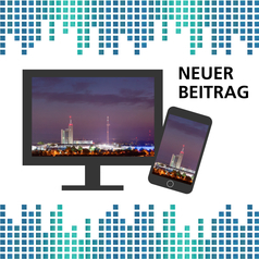 Auf einem Bildschirm und einem Smartphone ist die Skyline der Messe Hannover bei Nacht zu sehen.